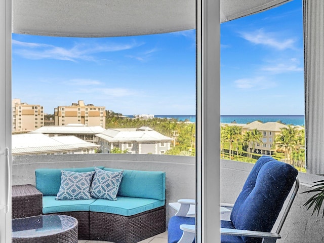 balcony featuring a water view