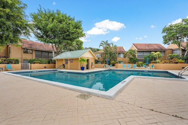 view of pool featuring a patio