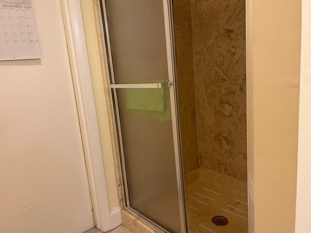 bathroom featuring an enclosed shower