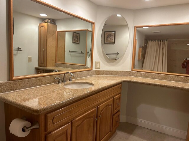 bathroom with vanity and a shower with shower curtain