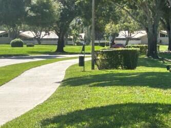 surrounding community featuring a lawn