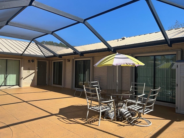 view of patio / terrace featuring a lanai