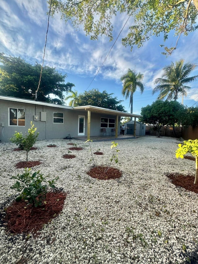 rear view of house featuring a patio