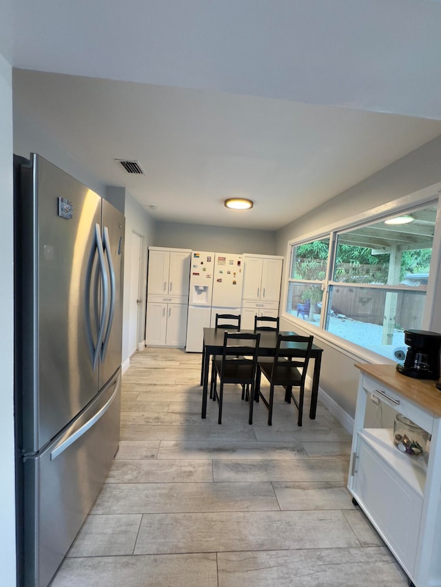 dining room with light wood-type flooring