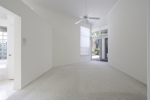 carpeted empty room with plenty of natural light, ornamental molding, and ceiling fan