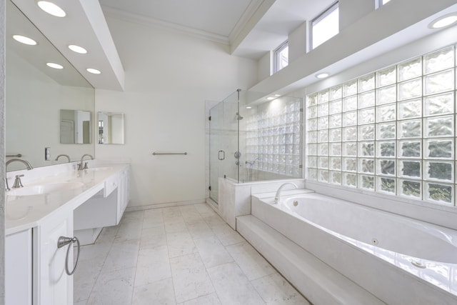 bathroom featuring plenty of natural light, separate shower and tub, crown molding, and vanity