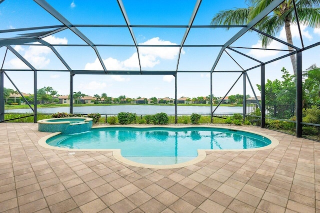 view of pool with glass enclosure, an in ground hot tub, a water view, and a patio