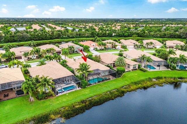 birds eye view of property featuring a water view