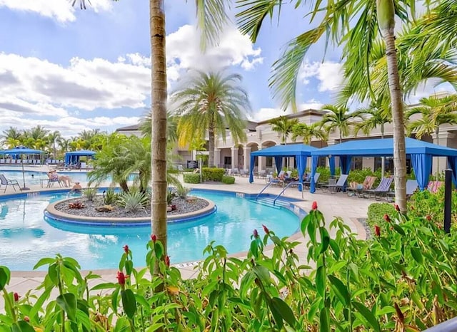 view of swimming pool with a patio area