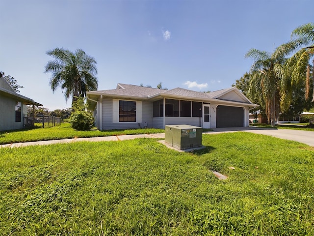 single story home with a front lawn and a garage