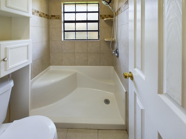 bathroom with independent shower and bath, toilet, and tile patterned floors