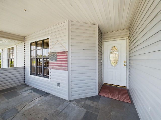 doorway to property with covered porch