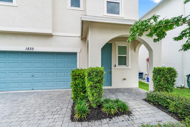 property entrance featuring a garage