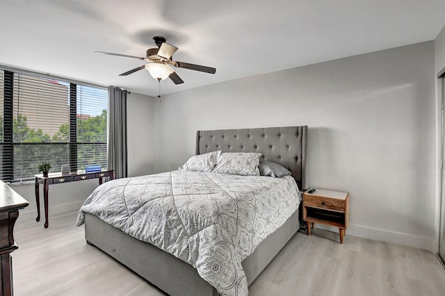 bedroom featuring ceiling fan and light wood-type flooring