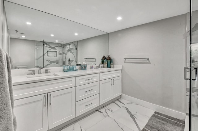 bathroom with walk in shower and vanity