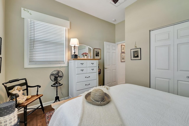 bedroom featuring a closet and dark hardwood / wood-style floors