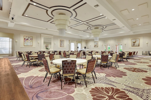 carpeted dining room with beamed ceiling and coffered ceiling