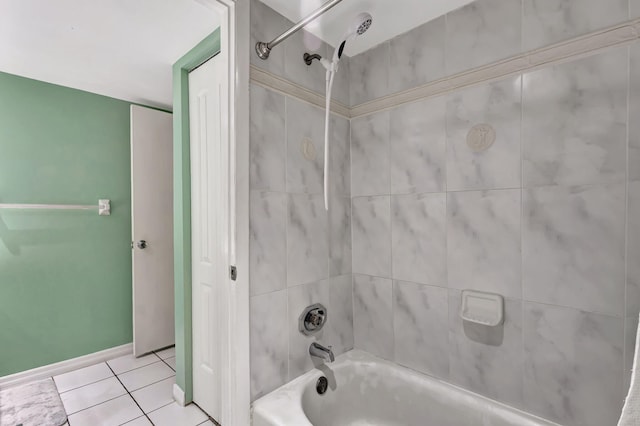 bathroom featuring tiled shower / bath combo and tile patterned floors