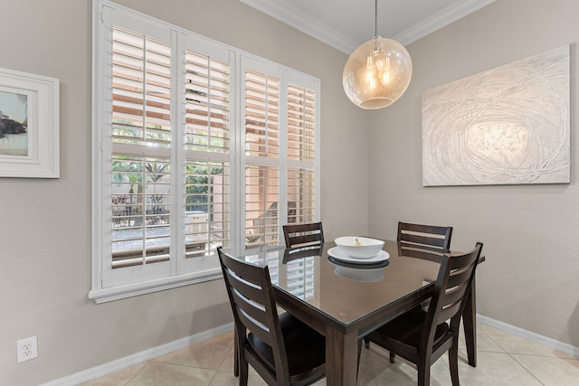 dining area featuring light tile patterned floors and ornamental molding