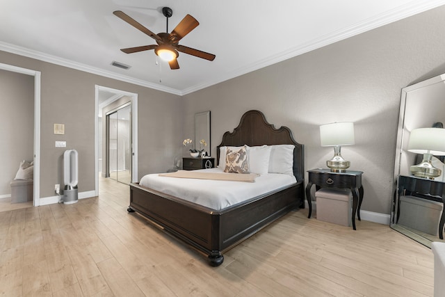 bedroom with ceiling fan, light hardwood / wood-style floors, and ornamental molding