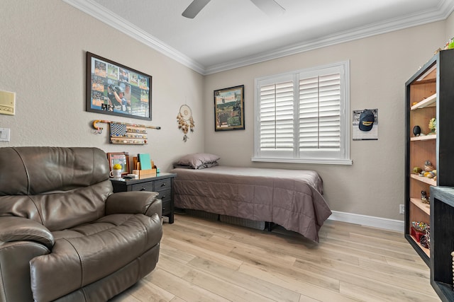 bedroom with ceiling fan, crown molding, and light hardwood / wood-style flooring