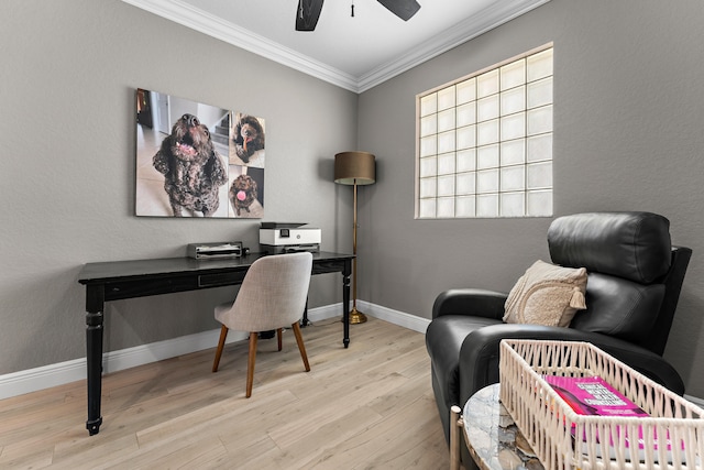 home office featuring ceiling fan, ornamental molding, and light hardwood / wood-style flooring