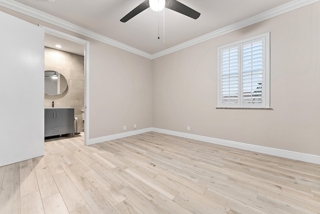 empty room featuring ceiling fan, sink, crown molding, and light hardwood / wood-style flooring