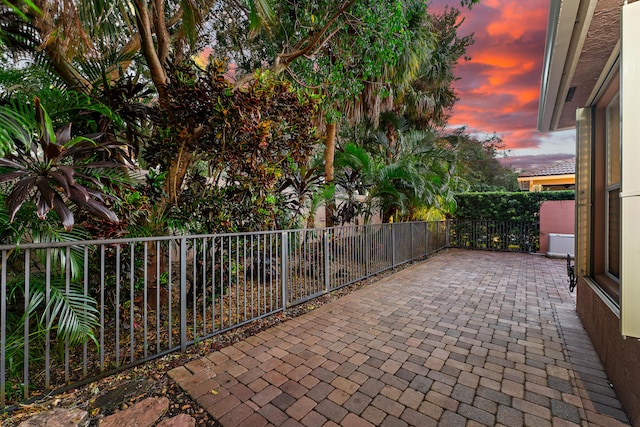 view of patio terrace at dusk