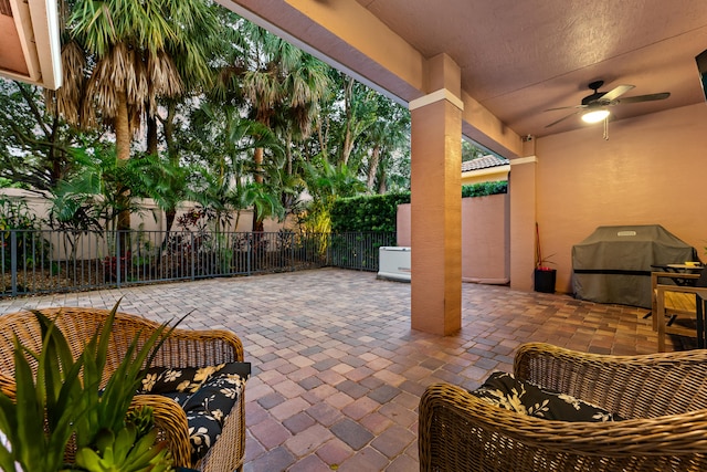 view of patio / terrace featuring a grill and ceiling fan