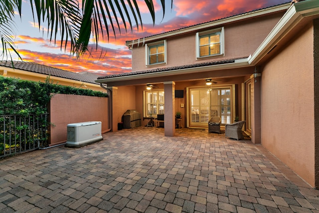 exterior space with a patio area and ceiling fan