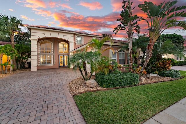 mediterranean / spanish-style house featuring french doors