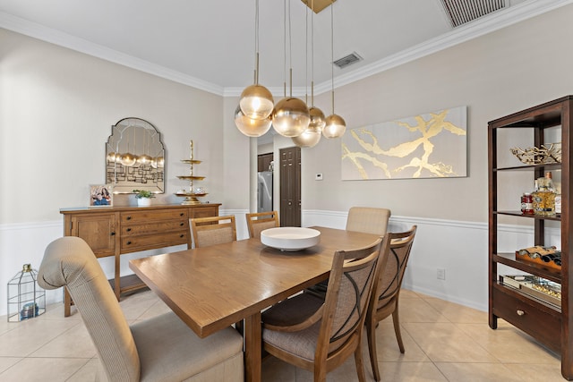 tiled dining space with crown molding