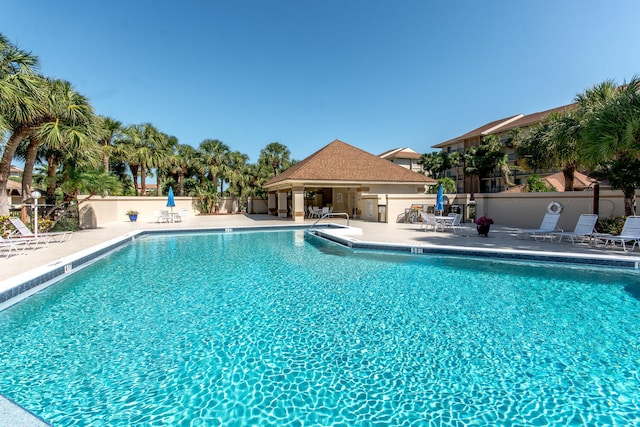 view of swimming pool featuring a patio