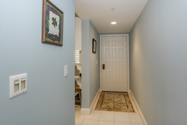 entryway with light tile patterned flooring