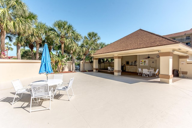 view of patio featuring ceiling fan