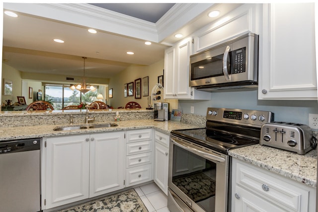 kitchen featuring white cabinets, a notable chandelier, sink, and appliances with stainless steel finishes