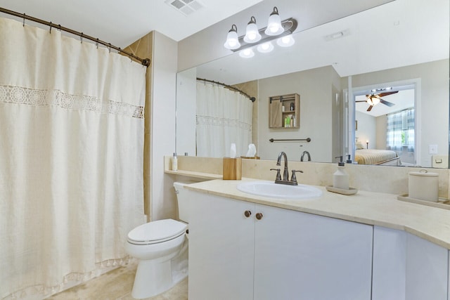 bathroom with vanity, tile patterned floors, toilet, and ceiling fan