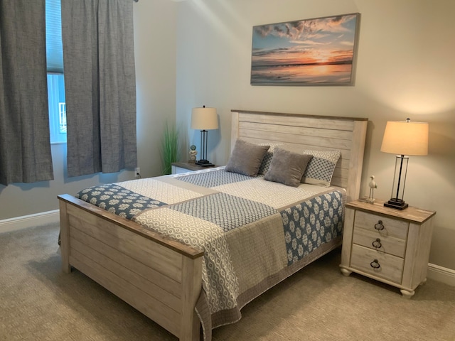 bedroom featuring light carpet