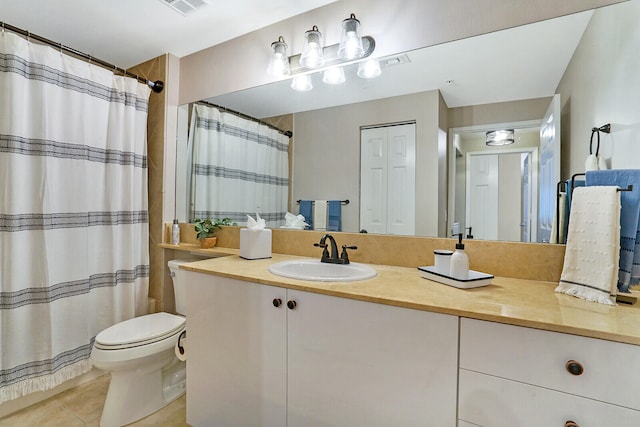 bathroom with vanity, toilet, tile patterned floors, and a shower with shower curtain