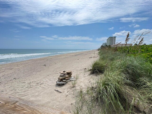 property view of water featuring a beach view