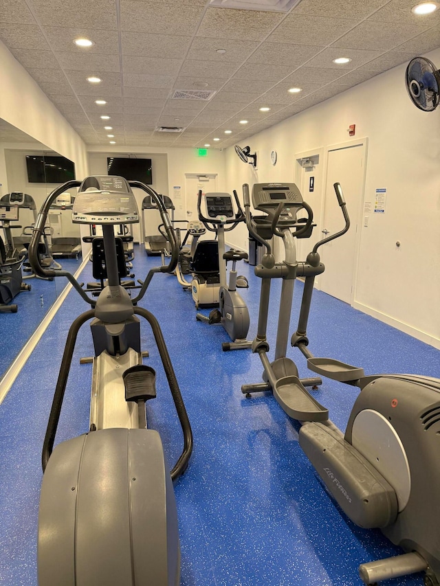 exercise room with a paneled ceiling