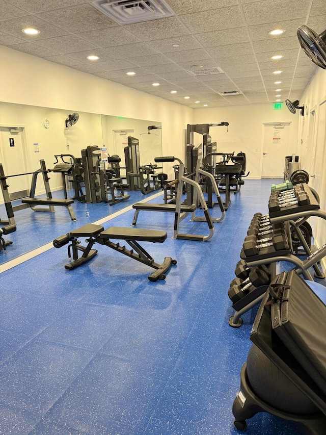 gym featuring a paneled ceiling