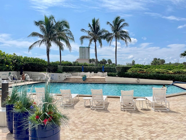 view of swimming pool with a patio