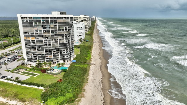 bird's eye view with a view of the beach and a water view