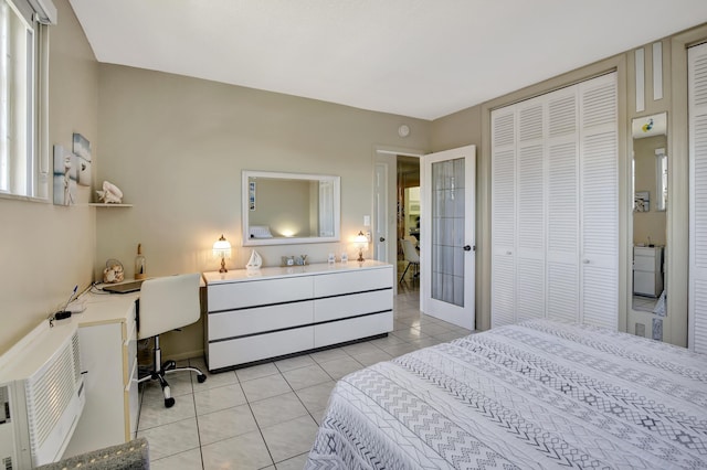 bedroom featuring built in desk and light tile patterned flooring