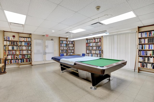 game room with french doors and a paneled ceiling