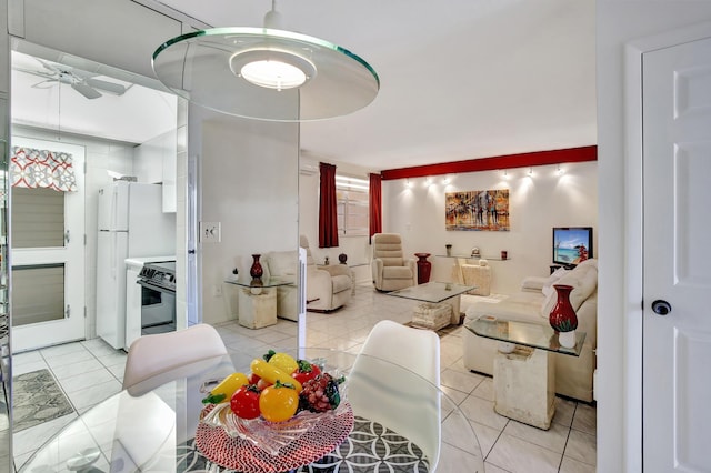 living room featuring ceiling fan and light tile patterned flooring