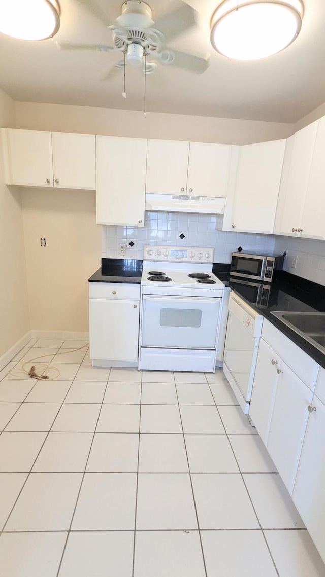 kitchen featuring ceiling fan, white cabinets, light tile patterned flooring, tasteful backsplash, and white appliances