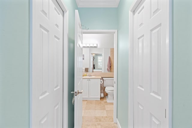 bathroom with ornamental molding, vanity, tile patterned flooring, and toilet