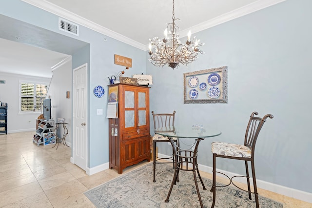 dining room with ornamental molding and an inviting chandelier